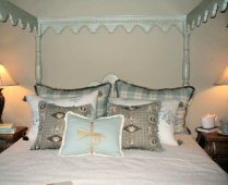 white wood canopy bed.